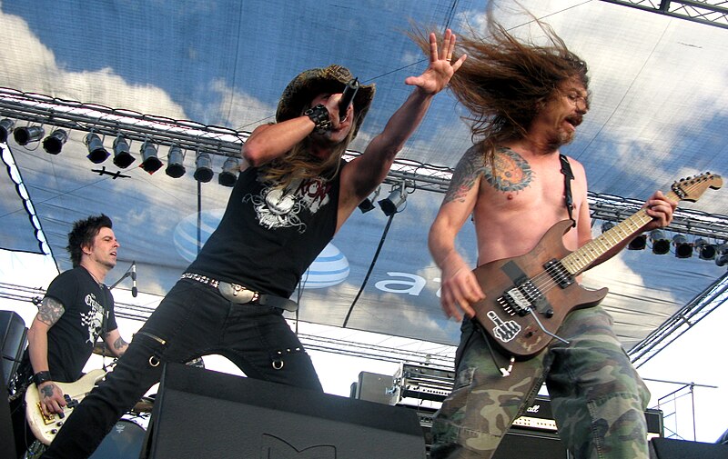 Scotti Hill performing with Skid Row, playing his Brown Guitar made from Warmoth parts.