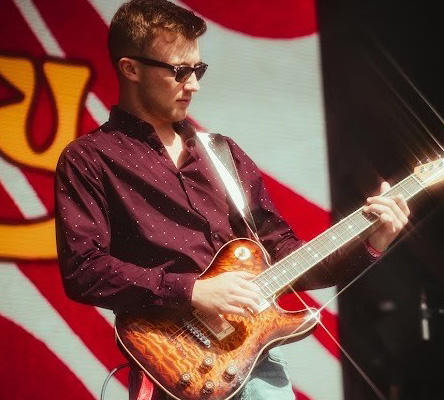 Jake Baynes Jake Baynes performing with a guitar he built from Warmoth parts.